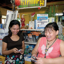 Salon owner Josephine Macaladad with Merlita Werlan at the Balayan Public Market in Batangas, Philippines