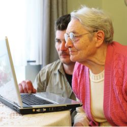 older adult with computer