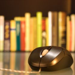 computer mouse and books
