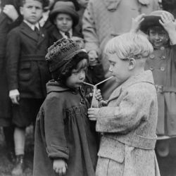 boy and girl share a drink at the White House Easter Egg Roll, 1922