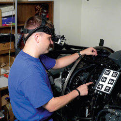 maintenance technician pressing virtual buttons
