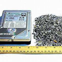 A hard disk drive, before and after shredding.