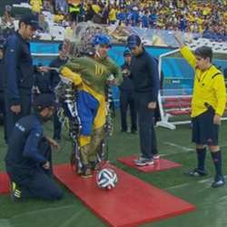 A paraplegic man used a mind-controlled robotic exoskeleton to make the first kick at the 2014 FIFA World Cup in Brazil.