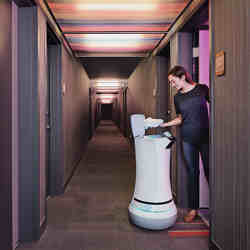 The Savioke Relay robot making a delivery to a hotel guest.