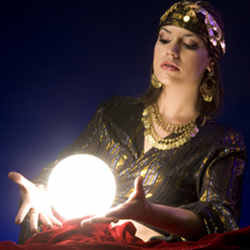 A "fortune-teller" tries to peer into the future through her crystal ball.