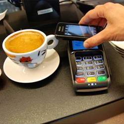 Paying for coffee with a smartphone.