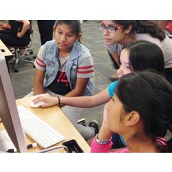 COMPUgirls participants program a Nao robot to dance.