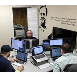 Software coders work at the Bit Source office in Pikeville, Ky.