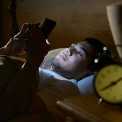 using mobile phone in bed