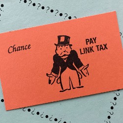 Monopoly Chance card stating Pay Link Tax