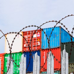 cargo containers and barbed wire