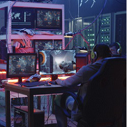 hackers and many screens in dark room, illustrative photo