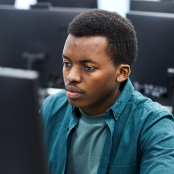 black student at computer display