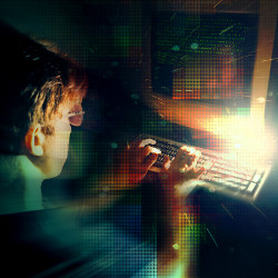 male at glowing keyboard