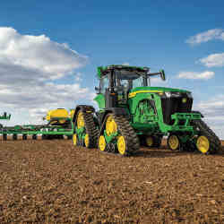 A John Deere 8RX connected tractor at work.