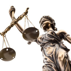 figure holding scales of justice