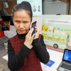visually impaired woman using Bus Listening app