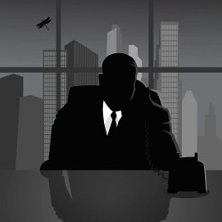 man in dark shadow on a phone