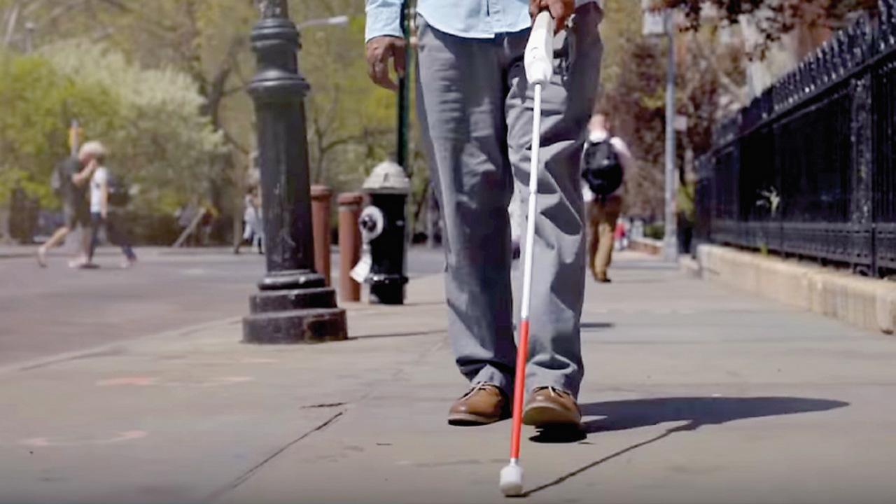 waist and legs of a user with a WeWalk smart cane