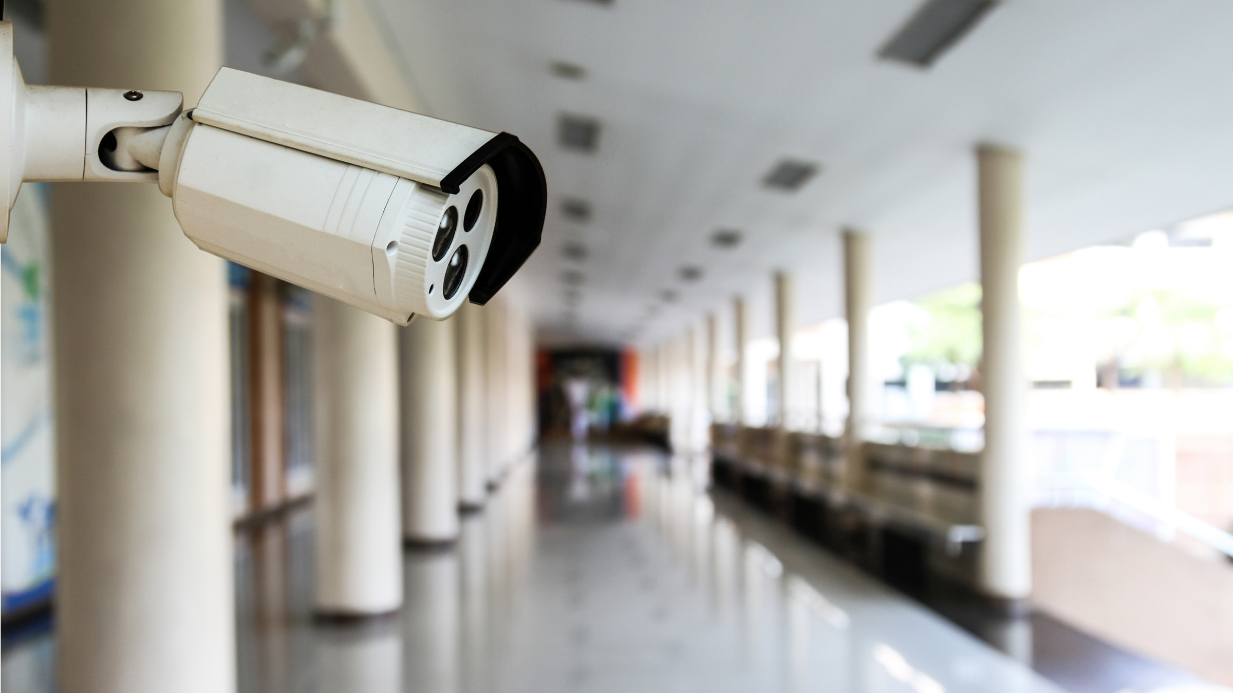 Credit: Shutterstock security camera in school hallway