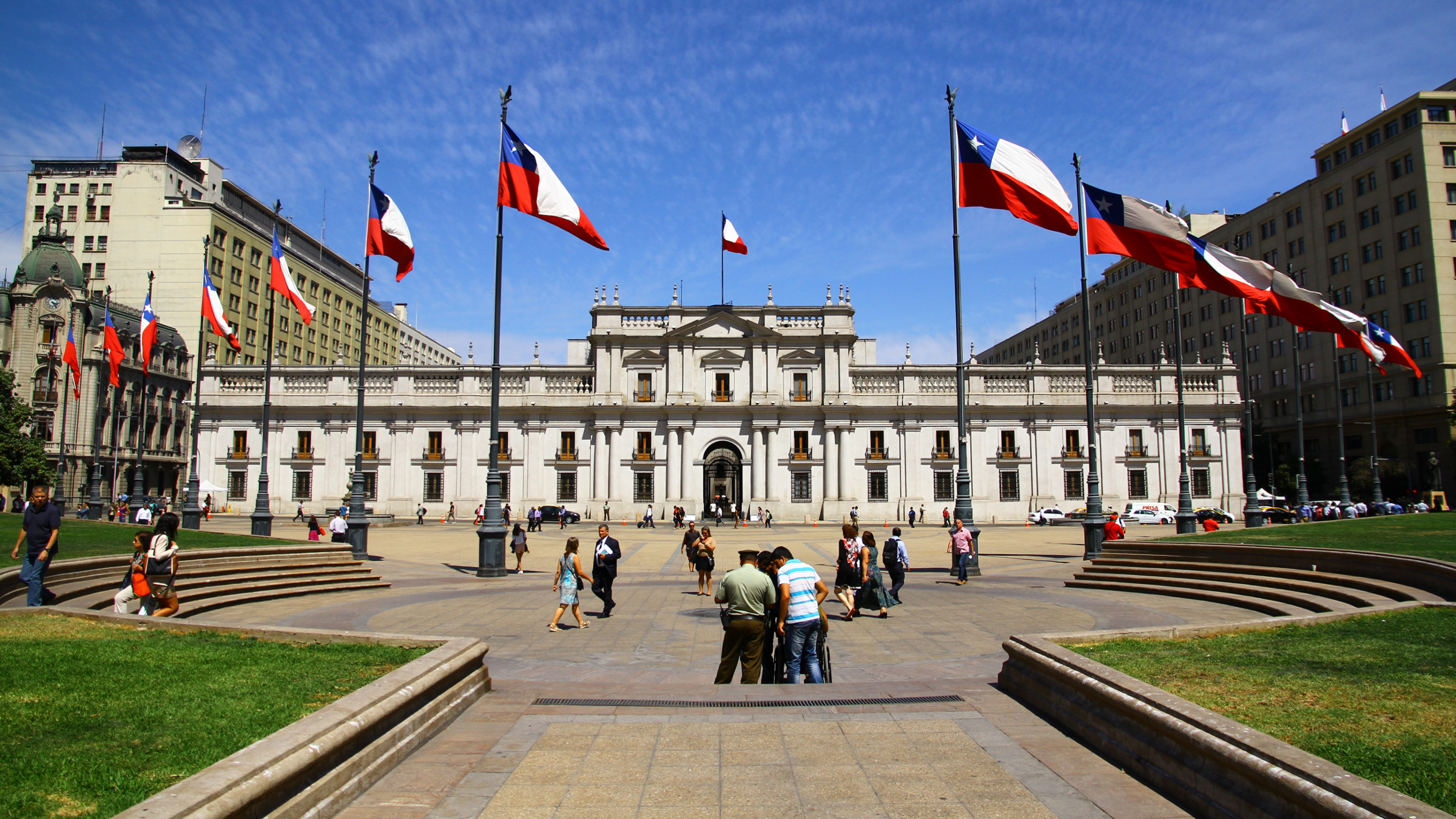 people gathered in front of La Moneda Palace, Chile