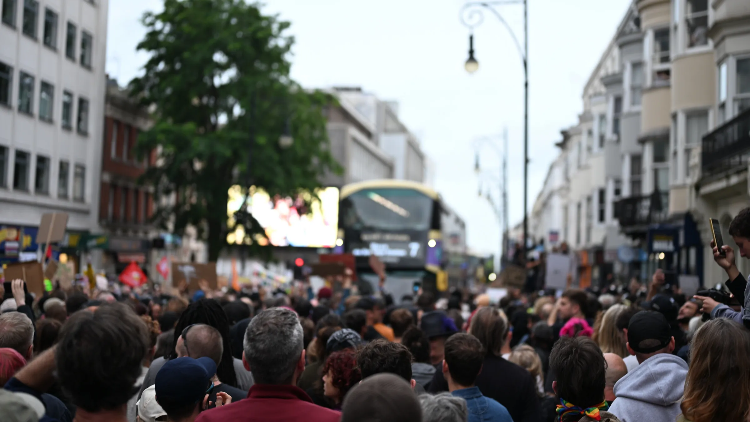 protest, bus in background