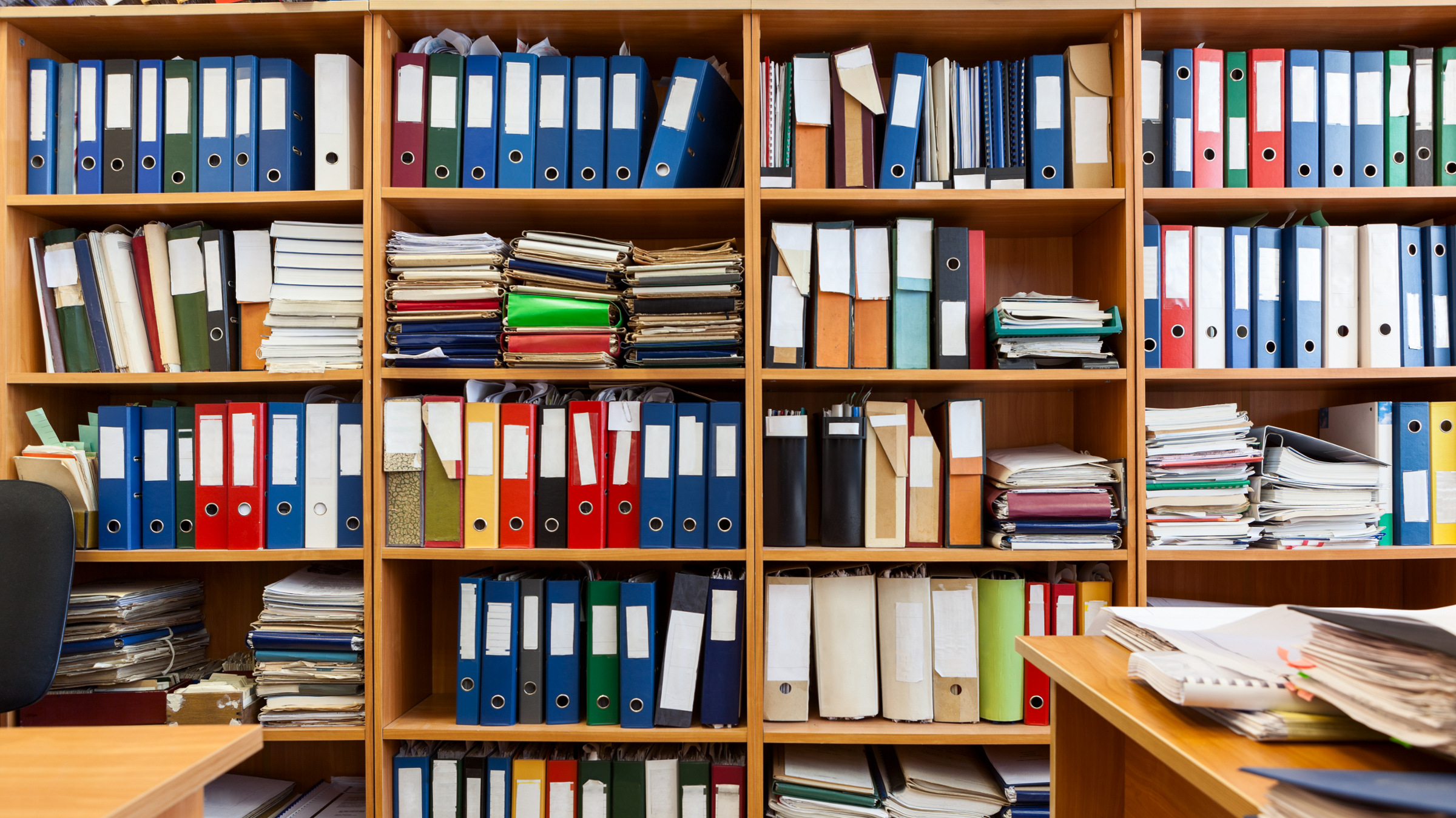 shelves with colorful binders