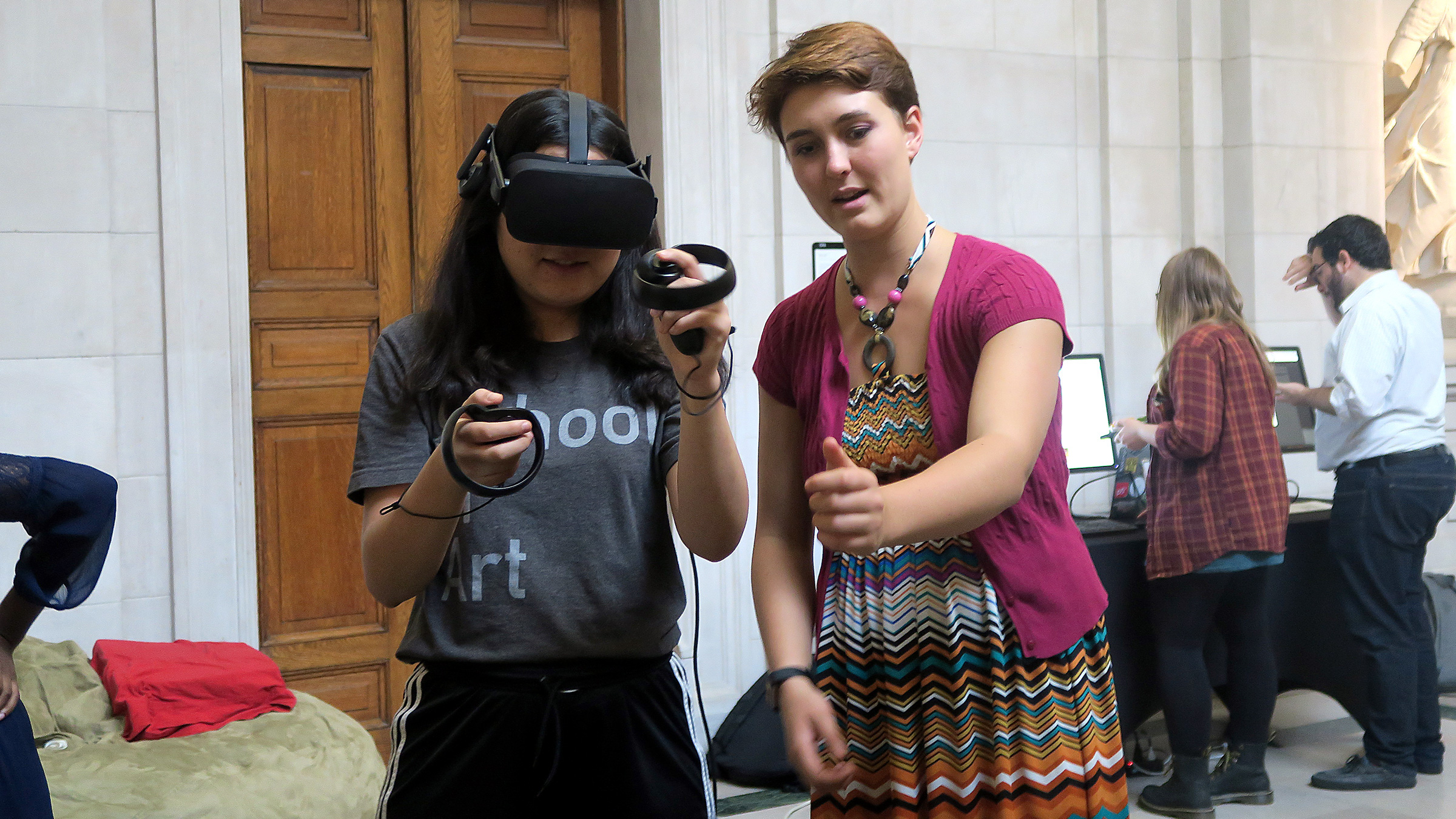 teacher with student wearing a VR headset