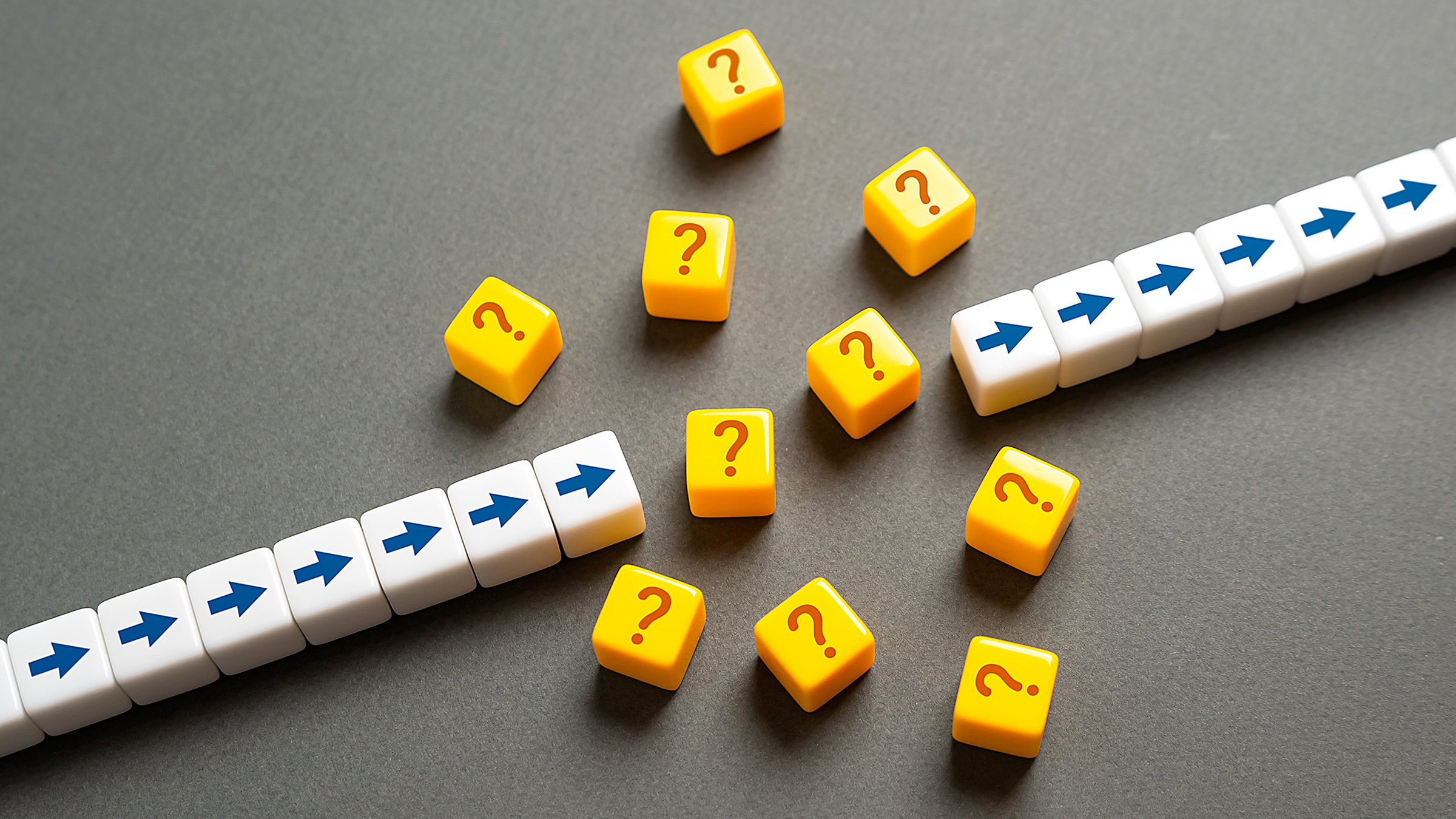 dice with arrows and question marks